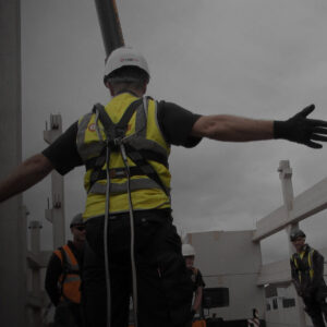 Man with hands out wearing fall arrest lanyards