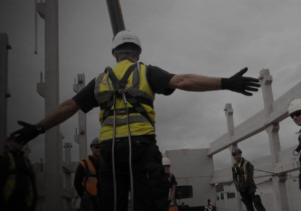 Man with hands out wearing fall arrest lanyards