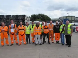 Team of operatives completing working at heights safety training wearing height safety gear.