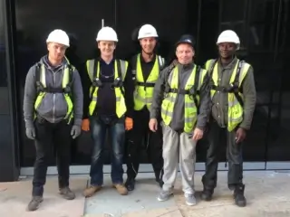 leading edge trainees wearing hi-vis, safety helmets and harnesses.