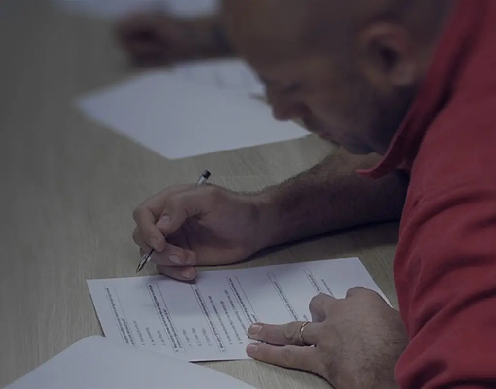 Male completing written part of height safety course
