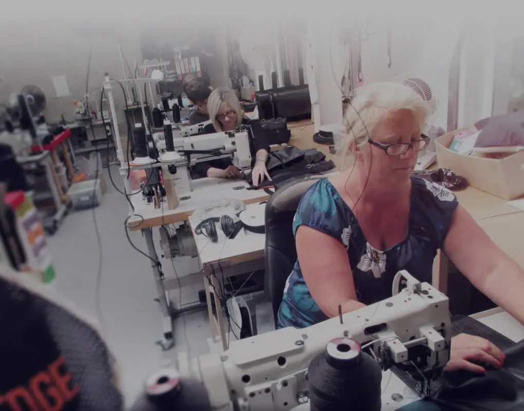 UK factory worker hand making leading edge height safety equipment